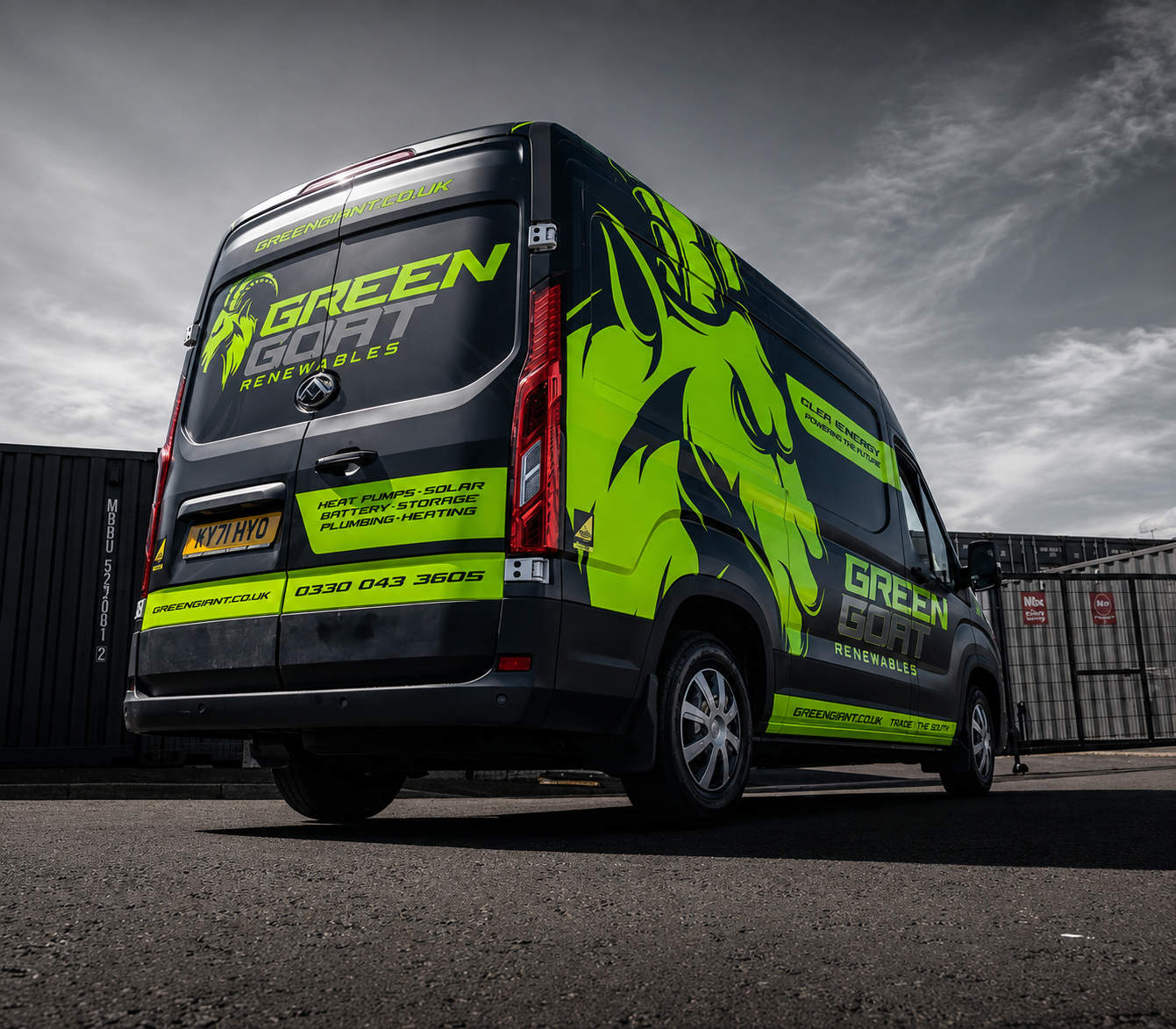 Dark grey Green Gort Renewables van with bright green energy branding and graphic wrap