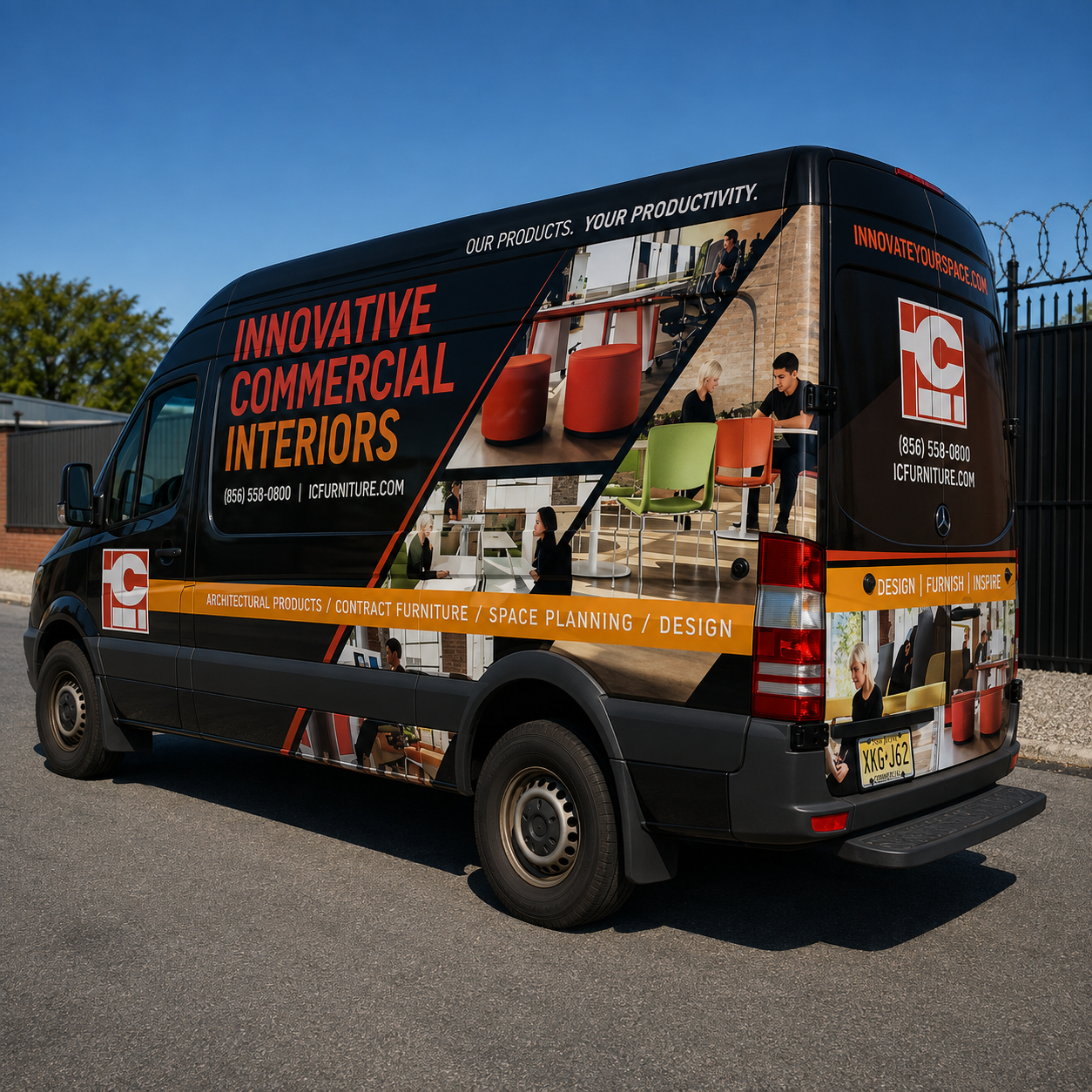 Black and orange commercial van wrap featuring interior furniture imagery and bold business branding.